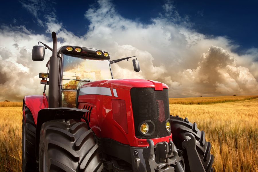 New Modern Tractor on the Barley Field in Sunset Light, Photomontage. See more pictures from my lightbox "On The Farm":